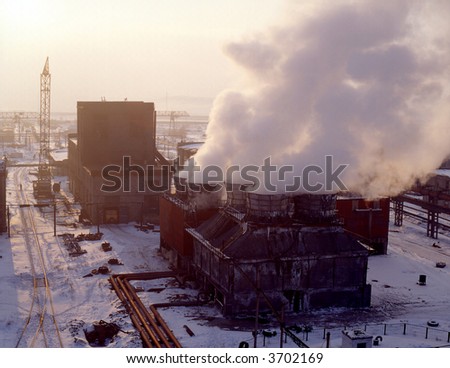 Early morning on metallurgical plant. Blast furnace at sunrise