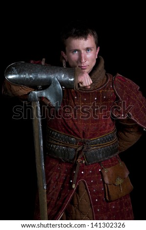 Warrior holding his sword on a black background
