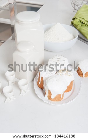 Cakes in the kitchen with white furniture in Easter eve