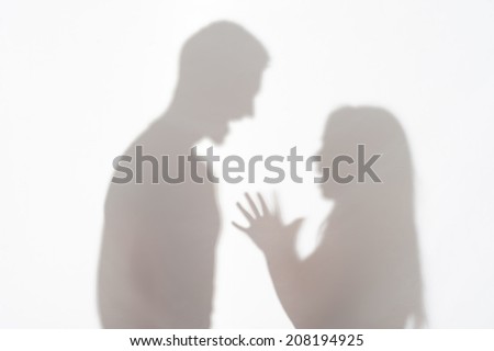 Silhouette of man and woman standing on white background and woman wanted to explain something gesticulating with her hands