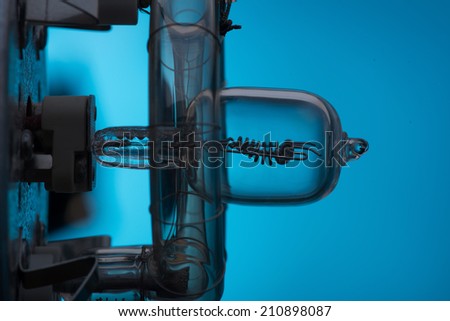 The internal structure of turned on spotlight side view. Isolated on blue background