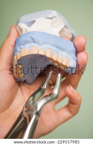 Dentist making some prosthetic appliance with the help of his equipment