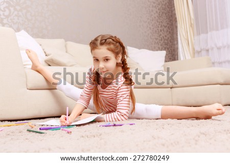 Comfy in any case. Little nice girl drawing with splitting legs apart