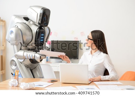 Nice girl and robot working in the office