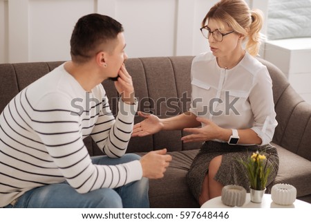 Positive professional therapist giving advice
