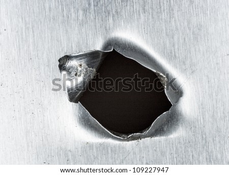 bullet hole in sheet metal