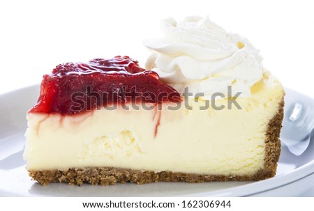 Fresh strawberry cheesecake with strawberry slices and whipped cream