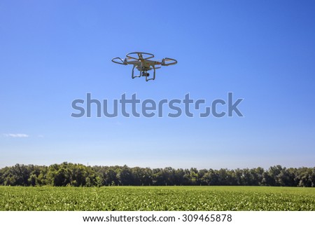 St.Louis Missouri. -August 24th : Editorial photo of a DJI Phantom 3 professional drone in flight with a mounted 4k digital camera on August 24th 2015 in St.Louis Missouri over Soybean field
