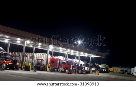 Truck stop at night getting diesel