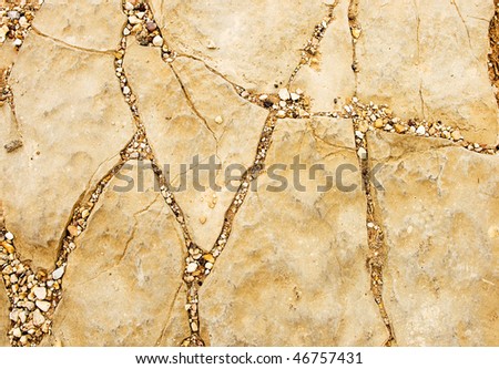 Natural stone texture with cracks and gravel