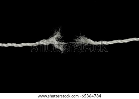 Frayed rope isolated over a black background