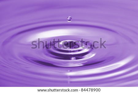 Colorful  purple water drop and splash