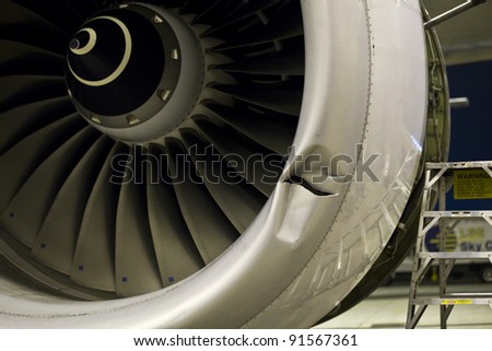 Damaged jet engine on large aircraft