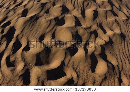 Sand Dunes made by the wind in the desert.National Park in Egypt. / Desert Texture