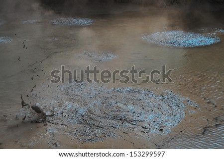 Hot mud boiling in the geyser field in Rotorua, New Zealand