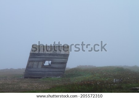 Deserted weathered cabin in Nordic landscape