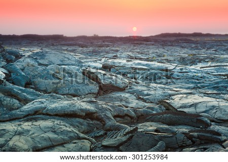 Beautiful sunset over molten cooled lava landscape in Hawaii Volcanoes National Park, Big Island, Hawaii