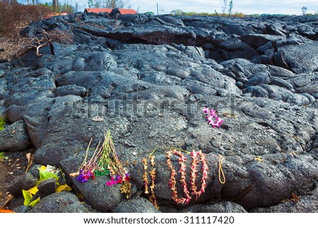 Gifts left for the goddess of volcanoes Pele on molten lava, Big Island, Hawaii