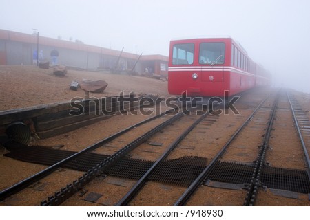 Railroad station at Pike’s Peak in Colorado during snow, fog, rain and drizzle.