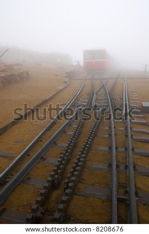 Railroad station at Pike?s Peak in Colorado during snow, fog, rain and drizzle.