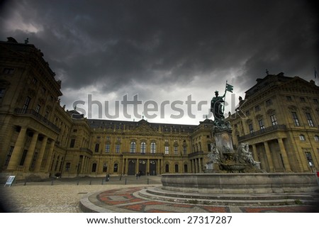 Fa?ade of Wurzburg residence palace and dark clouds