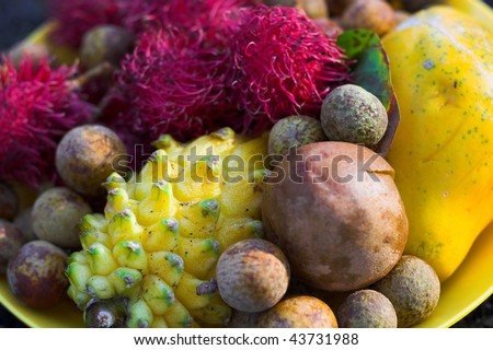 Macro of tropical lychee, rambutan, papaya, egg fruit