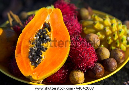 Macro of tropical lychee, rambutan, papaya, egg fruit