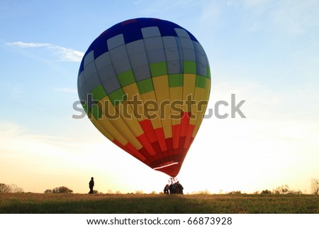 Hot Air balloon landed in the field at dawn