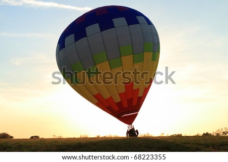 Hot Air balloon landed in the field at dawn