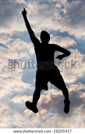 Silhouette of young man, jumping, against very cool sky
