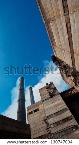 mining, concentrating factory and sunflower field