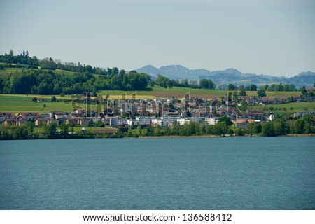 Swiss village on the bank of the lake Lucerne in a sunny day