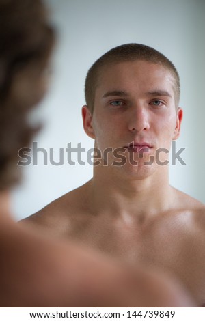 young nice man against other man on a light background