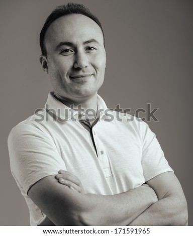 Portrait of a businessman in a shirt looking at the camera, age thirty-five, thirty-seven years