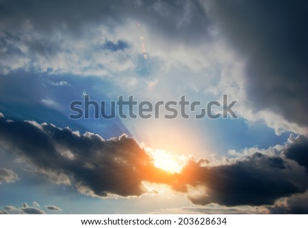 sky covered with clouds and sun rays