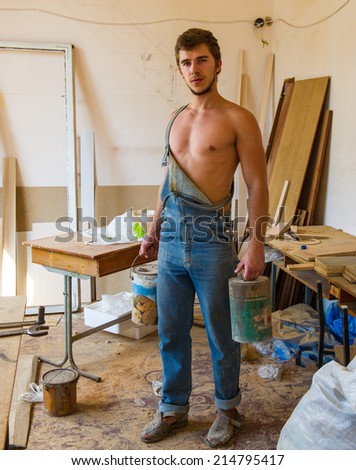 Portrait of a man in the room where the carpenter to make repairs