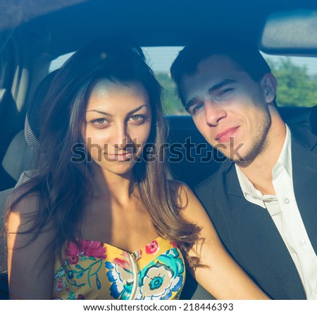 Portrait of a couple of young people in the car