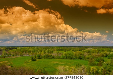 panorama landscape with clouds in a wooded area, the spring season