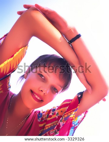 portrait of  girl with  lifted hands above  head