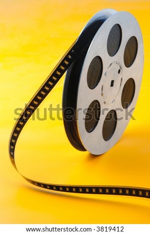 reel of  film of 16 mm on  yellow background