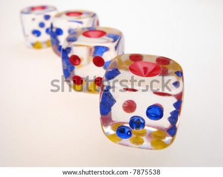 four playing roll the dice on  light surface