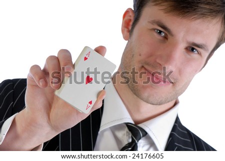 Young  man in  suit holds in  hand playing cards isolated on  white background