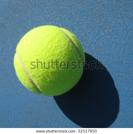 White line of tennis court and ball, sunny day, shadow