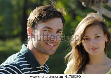 Portrait of pair young people on fresh air during the summer period