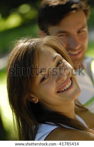 Portrait of pair young people on fresh air during the summer period