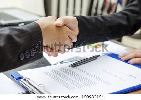Business Person Shaking Hands As A Deal Done