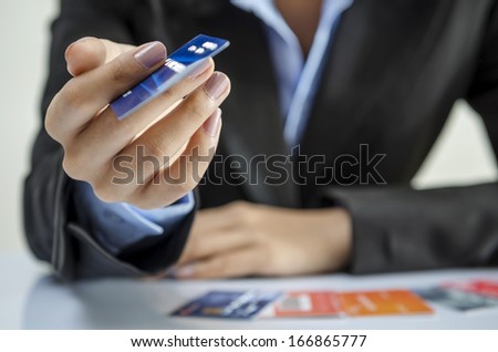 Businesswoman Giving A Credit Card