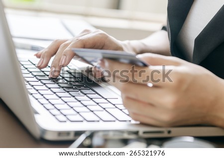 woman typing document in an office