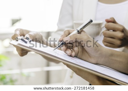 businesswoman showing the employer a business plan