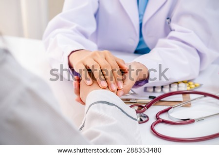front view of doctor consulting and cheering patient